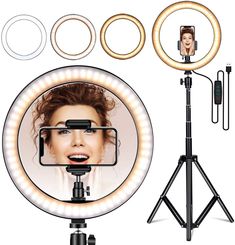 an image of a woman's face in the middle of a camera with lights and tripod