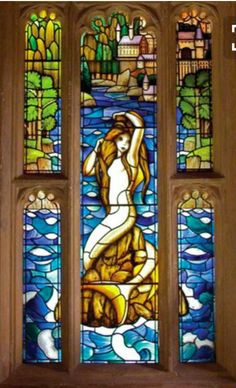 a stained glass window with an image of a woman in the water on it's side