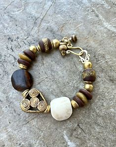 African Trade Bracelet Batik Bone Ghanaian and Ashanti Glass Wax Brass | eBay African Bracelets Handmade, Artisan Brown Bracelet With Unique Variations, Artisan Brown Bracelets With Unique Variations, African Beaded Bracelets, African Bracelet, Bohemian Chic Jewelry, African Inspired Jewelry, Handmade Ceramic Jewelry, African Bracelets