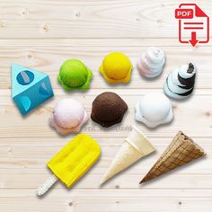 there are many different ice cream cones on the wooden table with an arrow pointing to them