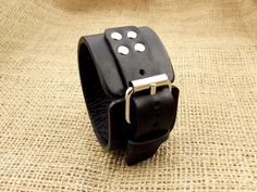 "Black Leather Cuff Watch Strap / FREE PERSONALIZATION(Laser Engraving) / We can Engrave your strap on the Front and on the Back side (Please just specify the side you want to be engraved in notes to seller). If you want a special location for the engraving, please specify it in notes to seller at checkout. Express Shipping available 🚀 (please see in order processing the available shipping upgrades for your location) This is a hand made WATCH BAND. Watch is not included. This watch leather stra Formal Black Adjustable Watch Bands, Adjustable Black Wrist Strap Watch Accessories, Black Adjustable Wrist Strap Watch Accessories, Black Adjustable Wrist Strap For Watch, Adjustable Cuff Watch Band With Wrist Strap, Black Cuff Bracelet Strap Watch Accessories, Adjustable Cuff Wrist Strap For Watches, Adjustable Black Cuff Watch Accessories, Black Leather Strap Cuff Bracelet