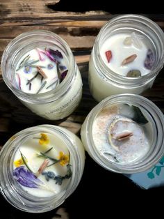 four jars filled with different types of flowers