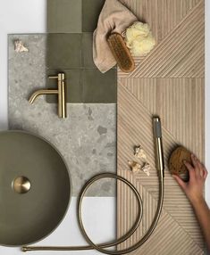 a bathroom with a sink, soap and brush on the counter top next to it