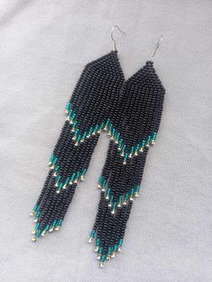 Black Beaded Earrings Evening Earrings Long Turquoise Ombre Earrings Beaded Earrings Black Chandelier Earrings Beaded Hanging Fringe Earrings Earrings are 14 cm (5.51 inches) long with hooks and 2.5 cm (0.98 inches) wide., 100% handmade. You can find my other products in my store: https://www.etsy.com/shop/SilankaUa?ref=seller-platform-mcnav Please note that due to lighting effects, brightness, contrast and other monitor settings, there may be slight differences in the color tone/hue of the photo on the website and the actual product. STORE POLICY 1. If the package is damaged or your post office tries to deliver you an empty package, refuse to receive it or file a claim, otherwise it cannot be proven. 2. International customers are responsible for any import fees, taxes and duties associat Black Beads Dangle Earrings For Festival, Black Bead Dangle Earrings For Festivals, Black Beaded Dangle Earrings For Festivals, Adjustable Beaded Turquoise Chandelier Earrings, Turquoise Beaded Earrings With Black Beads As Gift, Turquoise Earrings With Black Round Beads, Gift Turquoise Beaded Chandelier Earrings, Turquoise Beaded Chandelier Earrings As Gift, Turquoise Beaded Chandelier Earrings For Gift