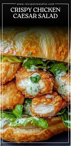 crispy chicken caesar salad on a croissant roll