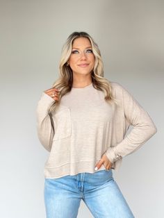 Feel comfortable yet stylish with the Mellow Mood Top. Featuring a rounded neckline, pocket detail, and relaxed fit, this crop top is essential for lounging, layering and brunch shopping. Crafted with the utmost comfort and luxury, the soft and stretchy fabric pairs well with any ensemble, making it a winter wardrobe staple. Enjoy versatile and effortless comfort and style with the Mellow Mood Top. Self 80% Polyester 14% Rayon 6% Spandex Machine wash cold. Rounded Neckline, Pocket Detail, Winter Wardrobe, Stretchy Fabric, Egift Card, Dresses Xs, Wardrobe Staples, Layering, Crop Top