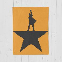 a yellow and black star with a man on it