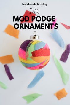 an ornament made out of colored paper with the words diy mod podge ornaments