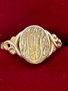 A 10K yellow gold vintage multi-initial signet ring for your consideration. This adorable ring is hallmarked 10K and guaranteed to be such.  It features an elaborately decorated signet with intricate calligraphic lettering on a decorative vintage art deco setting. The calligraphy is so decorative that it is hard to make out the letters so I've added pictures taken with the ring in two different directions. The top of the ring measures 9.7mm x 8.7mm.  It is a size 7 1/2 and weighs in at 1.60 gram Collectible Yellow Gold Signet Ring With Initials, Victorian Gold Engraved Collectible Ring, Gold Oval Signet Ring With Maker's Mark, Vintage Oval Signet Ring With Hallmarks, Vintage Signet Ring With Intricate Design For Anniversary, Victorian 14k Gold Signet Ring With Initials, Antique Signet Ring With Maker's Mark For Formal Occasion, Antique Signet Ring With Initials For Formal Events, Victorian Yellow Gold Initial Ring