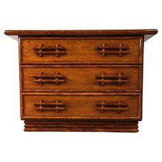 an old wooden dresser with four drawers and knobs on the front, against a white background