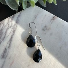 These Black Gemstone Earrings Feature Natural 10x14mm (1/2 Inch) Aaa Black Onyx Faceted Drops Wire Wrapped In 925 Sterling Silver. They Measure 1 1/4 Inch From The Bottom Of The Drop To The Top Of Their 925 Sterling Silver French Style Ear Wires. + About Black Onyx: Energetically: A Strengthening Stone, Black Onyx Instills The Courage To Be The Master Of Your Own Destiny. It Aids In Self-Control, Alleviating Worry And Fear. Connections With The: Root Chakra Zodiac Signs Of Leo And Capricorn Birt Black Hypoallergenic Sterling Silver Jewelry, Black Teardrop Gemstone Earrings, Black Drop Jewelry, Black Drop Earrings For Gift, Black Hypoallergenic Sterling Silver Earrings, Black Sterling Silver Teardrop Earrings, Black Sterling Silver Teardrop Dangle Earrings, Black Teardrop Sterling Silver Earrings, Classic Black Teardrop Earrings