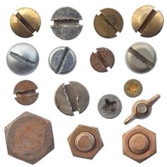 several different types of metal buttons on a white background