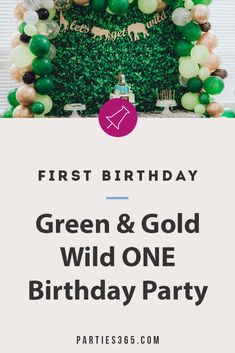 a green and gold wild one birthday party with balloons