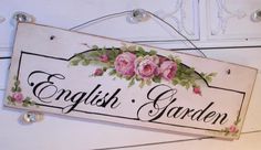 an english garden sign hanging on the wall