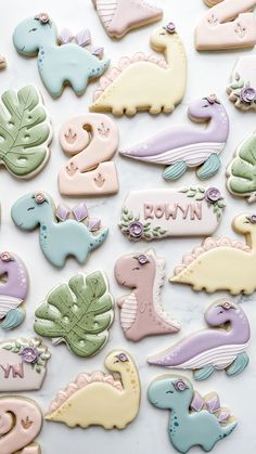 decorated cookies are arranged on a marble surface