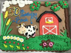 a 50th birthday cake with a farm scene and cow on the front, surrounded by flowers