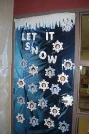 a door decorated with snowflakes and the words let it snow