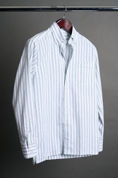 A bespoke shirt crafted from a textured cotton blend fabric in an oversized candy stripe. The larger striped pattern gives it a punch of style, making it a great casual shirt that can be worn with chinos or jeans - or under suits and jackets. The lightweight fabric drapes effortlessly, making it an ideal choice for those seeking a sophisticated yet relaxed look. Classic Striped Linen Tops, Pinstripe Cotton Shirt For Work, Spring Cotton Dress Shirt With Striped Collar, Classic Long Sleeve Yarn-dyed Shirt, Striped Shirt With Relaxed Fit And Spread Collar, Classic Yarn-dyed Long Sleeve Shirt, Pinstripe Cotton Top With Spread Collar, Classic Relaxed Fit Yarn-dyed Shirt, Classic Yarn-dyed Shirt In Relaxed Fit