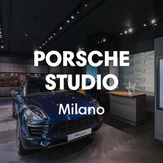 a blue sports car is on display in a showroom with the words porsche studio