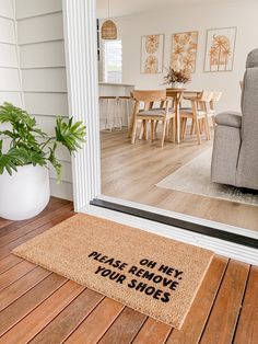 a door mat that says, oh hey please remove your shoes on the front porch