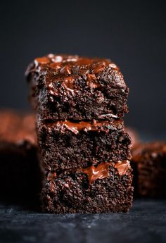 three chocolate brownies stacked on top of each other