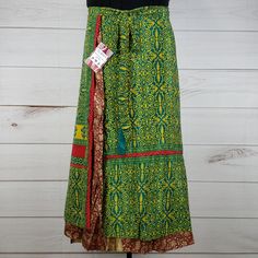 Nwt Darn Good Yarn Brand Recycled Sari Silk Wrap Skirt. Reclaimed Material From Used Saris. Ankle Length (Approx. 40 In.). Dgy Size Goddess (Us Size 22-26). Reclaimed Material Means Flaws (Stains, Holes, Ink Errors, Thread Pulls, Etc.) Are Common And Expected! I List What I See, But May Miss Some. Pinholes, Thread Separations, Couple Small Stains, Line Of Thread Pulls/Pinholes, Ink Error Speckles On Overskirt. Thread Separations, Couple Small Stains On Underskirt. No Sewn-In Brand/Size Tag. Green Tiered Skirt Bottoms For Festival, Festival Green Tiered Skirt Bottoms, Green Lined Skirt Bottoms For Festival, Green Lined Skirt For Festival, Traditional Green Skirt For Spring, Fitted Green Ankle-length Bottoms, Traditional Long Wrap Skirt For Spring, Green Long Skirt For Festival, Spring Green Cotton Wrap Skirt