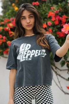 This Led Zeppelin 1968 Mothership Tee is the ultimate in rock-star style! Featuring a Led Zeppelin graphic, grinding details on the shoulders and neckline, and a boxy, relaxed fit, this tee will have you looking like a total rock god. And it's super soft too, thanks to a silicon and enzyme wash and 100% organic cotton. So, channel your inner rocker and hit the town! Color: Vintage Black Fabric: 100% Organic Cotton Model wears a small Ethically made in Los Angeles, CA Teal Fabric, Rock Tees, Fall Clothes, Star Style, Color Vintage, Yoga Shop, Fleetwood Mac, Rock Star, Led Zeppelin