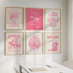 four pink and white posters hanging on the wall above a dining room table with chairs