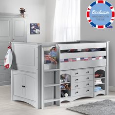 a child's bedroom with grey furniture and white walls