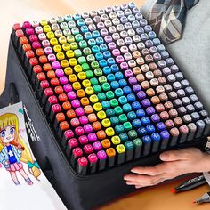 a person is holding a large multicolored keyboard