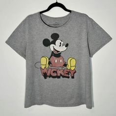 Vintage Mickey Mouse T-Shirt Vintage Mickey Mouse Men's Size L Grey Graphic Print T-Shirt In Perfect Condition Measurements W:22/56cm L:26.5/67.5 Size L Machine Washed 100% Cotton #Disney #Cartoon #Waltdisney #Cartoontees #Mickeymouse Vintage Gray Tops With Logo Print, Mickey Mouse Graphic Tee With Crew Neck, Vintage Mickey Mouse Cotton Top, Retro Mickey Mouse Short Sleeve Tops, Retro Mickey Mouse Crew Neck T-shirt, Retro Mickey Mouse Top For Streetwear, Mickey Mouse T Shirt, Disney Men, Disney Tees