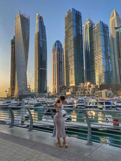 Girl in Dubai Marina wearing a nude skirt, a white crop top and gold high heels. Cute outfit. Cute view. Cayan Tower, Dubai Photoshoot, Ferrari World Abu Dhabi, Nude Skirt, Ferrari World, Dubai Marina, Relaxing Yoga, Female Poses