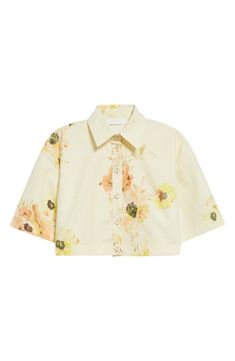 Dropped shoulders and boxy sleeves relax this cropped cotton shirt lightly dusted with blooms. Front button closure Spread collar Elbow-length sleeves 100% cotton Dry clean Imported Designer Clothing