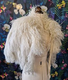 It's been a number of years since I have got my hands on one of these! Superb and super rare, original 1920s Ostrich feather cape. This has been kept in beautiful condition. The best I have seen by far. The only sign of its wear is a very slight spot of discolouration to the silk chiffon lining, as photographed. The feathers are incredibly fluffy, especially around the collar area and they are fresh and clean. It can be fastened with the long silk chiffon ties. One size, but photographed on my U Feathered Cape, Ostrich Feather Shawl, Ostrich Feather Boa, Burlesque Feathers, Feather Shawl, Vintage Fur Shawl, Feather Cape, Flapper Era, Angel Gabriel