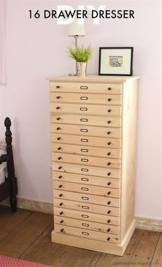 a wooden dresser with drawers and pictures on top