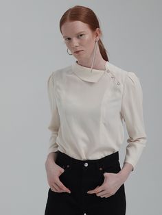 Editor's NotesUnique design asymmetrical detail collar puff sleeve design blouse top. This has a casual and classy mood that is great to style in a casual and formal way with various of outfits.- Unique detail pointed blouse top- Chic and feminine silhouette when worn- Natural drape like silhouette design wear- Great to style in various of luxurious waysMeasurements(in.)One Size (XS-M)- Total Length: 23.43 in.- Shoulder: 14.80 in.- Chest: 37.13 in.- Hem: 40.31& Fall Office Tops With Puff Sleeves, Fall Office Puff Sleeve Tops, Formal Blouson Sleeve Top For Fall, Classic Puff Sleeve Office Tops, Versatile Blouse With Blouson Sleeves For Work, Classic Puff Sleeve Tops For Office, Casual Fall Blouse For Semi-formal Occasions, Casual Blouse For Semi-formal Fall Occasions, Casual Semi-formal Blouse For Fall