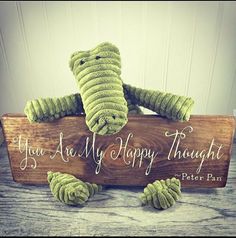 a stuffed elephant sitting on top of a wooden sign that says, you are my happy thought