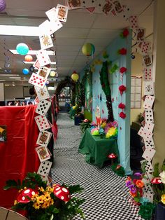 an office decorated for mardi gras with decorations on the walls and tables covered in green cloths