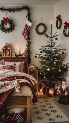 a bedroom decorated for christmas with candles and decorations