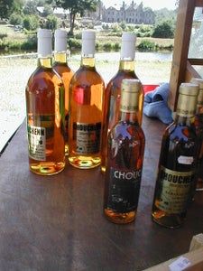 several bottles of wine are lined up on a table