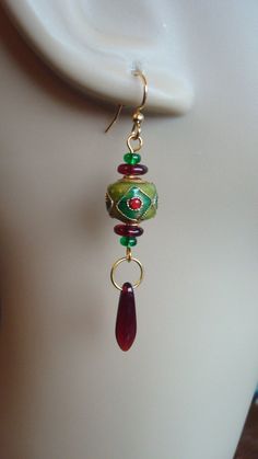 These beauties are one of a kind with gorgeous coisonne focal beads and Czech glass accenting beads as well as stunning Czech glass spear beads suspended from the bottom. Ear wires are gold plated surgical steel. Bohemian Teardrop Glass Jewelry, Bohemian Beaded Earrings With Dangling Glass Beads, Bohemian Glass Beaded Earrings With Ear Wire, Bohemian Beaded Earrings With Glass Ear Wire, Gold Glass Earrings With Dangling Beads, Gold Fusion Jewelry With Colorful Beads, Green Spiritual Jewelry With Dangling Beads, Spiritual Green Jewelry With Dangling Beads, Spiritual Czech Glass Earrings For Jewelry Making