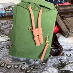 10x11x5 Trendy Brown Canvas Backpack, Green Casual Crossbody Backpack, Casual Green Crossbody Backpack, Trendy Khaki Backpack With Adjustable Strap, Adjustable Canvas Bags For Everyday Use, Casual Khaki Backpack For Everyday Use, Everyday Khaki Canvas Backpack, Casual School Shoulder Bag With Leather Handles, Adjustable Green Bags For Everyday Use