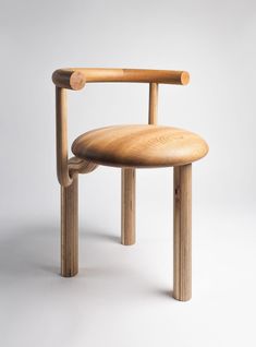 a wooden chair sitting on top of a white floor