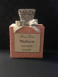 a pink soap bar with a silver bow on it's top that says, miss dior madison sweet sixteen