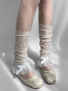 Complete your summer kawaii look with these delicate lace leg sleeves. Perfect for embracing the Y2K aesthetic, these white leg sleeves add a touch of femininity and charm to any outfit. Made from lightweight material, these leg warmers are ideal for layering and creating that sought-after 'stacked' leg effect.  Please note that this product includes a single pair of leg sleeves. Garment Size SizeFree SizeFull Length42Cuff24/26 Summer Lace Trim Fitted Socks, Fitted Lace Trim Socks For Summer, Spring Thigh-high Legwear With Lace Trim, Summer Lace Socks With Lace Trim, Fitted Ruffled Socks For Summer, White Lace Fitted Stockings, Feminine White Legwear For Spring, Fitted White Lace Stockings, White Footless Legwear For Spring