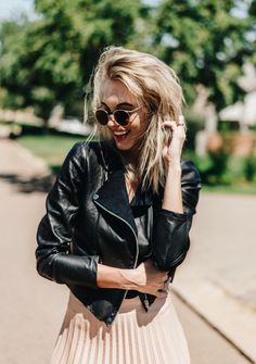 Genuine leather jacket made from recycled vintage leather pants by Oscar Ncube. Blonde hair. Pleated skirt. Sunglasses. Vintage Leather Pants, Body Measurements, Jacket Outfits, Pleated Skirt