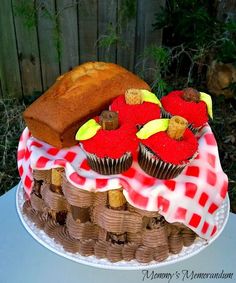 a cake with red and yellow frosting on top of it next to a loaf of bread