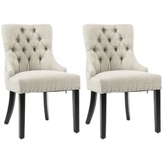 two white chairs with black legs and tufted backrests, side by side