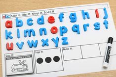 the letters and numbers are made out of plastic magnets on a sheet of paper