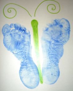 an image of a butterfly made out of blue and green ink